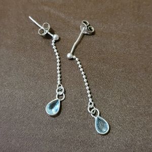 Sterling silver earrings with light blue stone